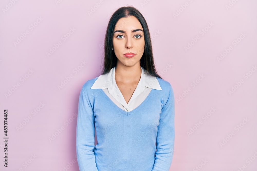 Beautiful woman with blue eyes standing over pink background depressed and worry for distress, crying angry and afraid. sad expression. Beautiful woman with blue eyes standing over pink background depressed and worry for distress, crying angry and afraid. sad expression.