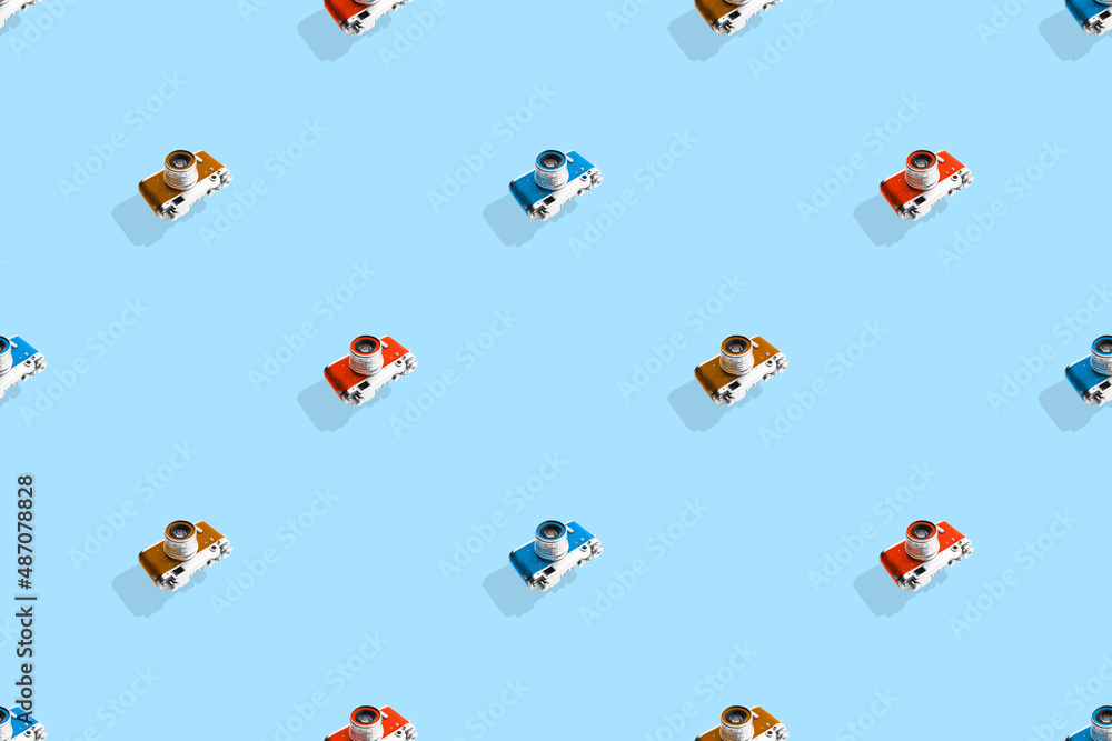 Seamless pattern from old cameras .Background on the theme of photography and photographic equipment. Seamless pattern from old cameras .Background on the theme of photography and photographic equipment.