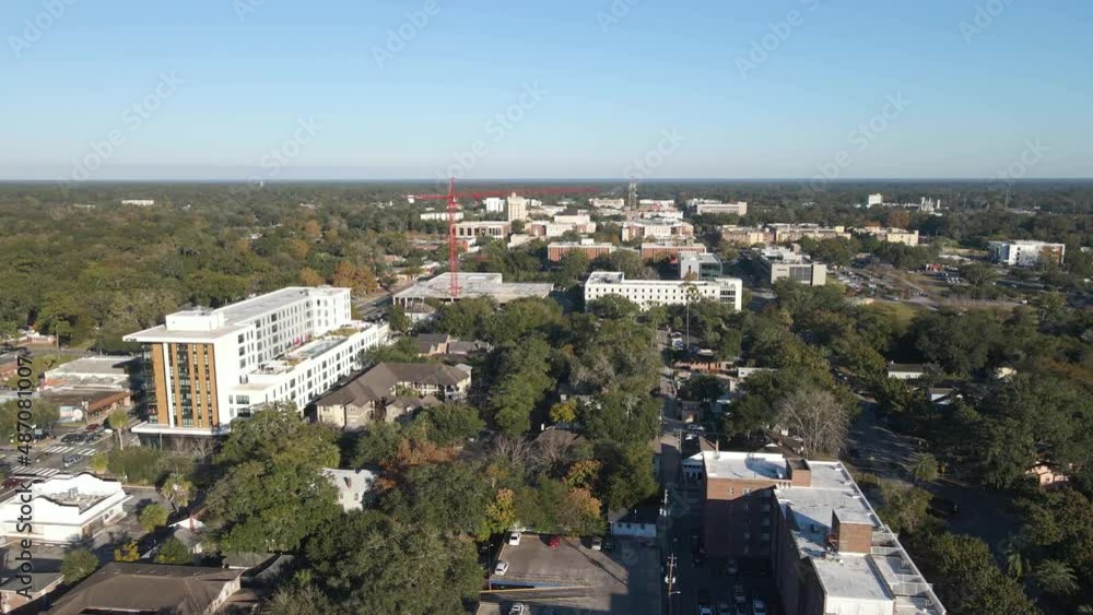 Aerial view over Gainesville city, in sunny Florida, USA - tracking, drone shot Aerial view over Gainesville city, in sunny Florida, USA - tracking, drone shot