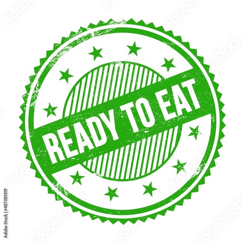READY TO EAT text written on green grungy round stamp.