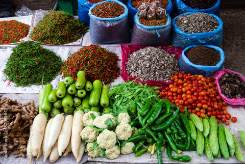 Fresh tropical vegetables and spices on street market. Local morning market in Luang Prabang, Laos.