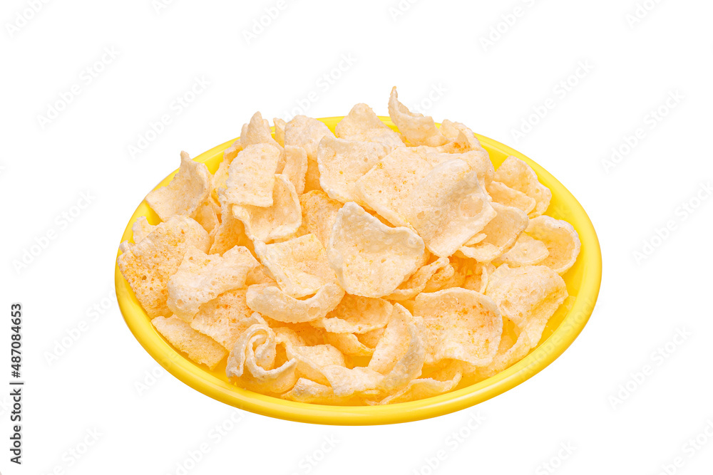 potato chips on yellow plate isolated on white background. side view potato chips on yellow plate isolated on white background. side view