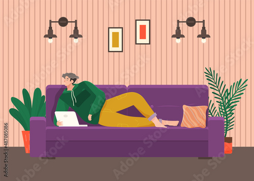 Man lying on couch with computer, holding laptop and correspondence surfing in Internet. Male character communicating with friends, studying remotely, sitting on sofa, relaxing, resting after work