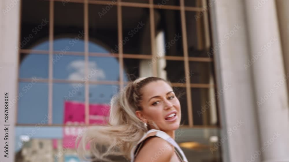 Female Fashion Model Dancing And Spinning With Blond Ponytail Female Fashion Model Dancing And Spinning With Blond Ponytail