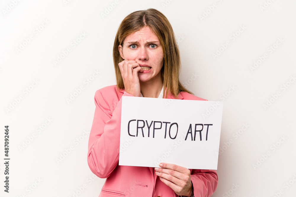 Young English business woman holding a crypto money placard isolated on white background biting fingernails, nervous and very anxious. Young English business woman holding a crypto money placard isolated on white background biting fingernails, nervous and very anxious.