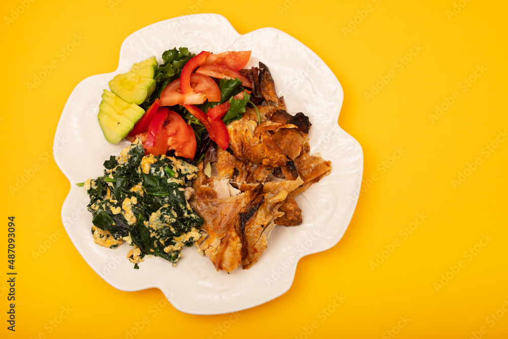 grilled chicken with egg and spinach, fresh salad grilled chicken with egg and spinach, fresh salad