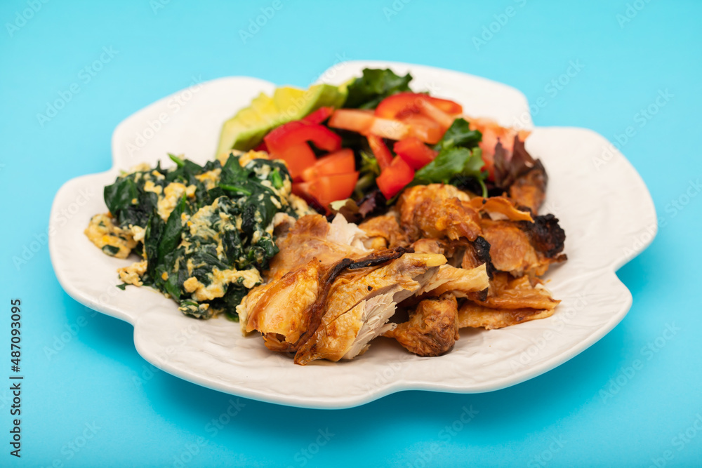 grilled chicken with egg and spinach, fresh salad