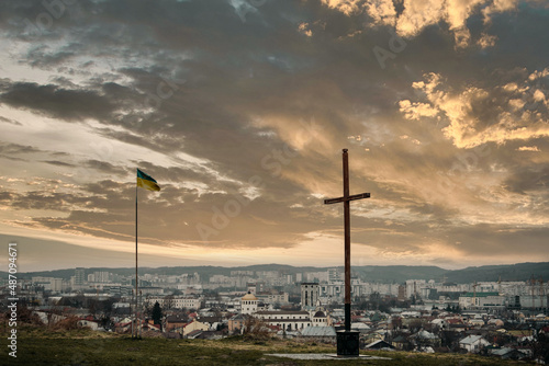 cross on a background of the city. Cross on the hill.