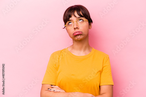 Obraz na plátně Young hispanic woman isolated on pink background tired of a repetitive task