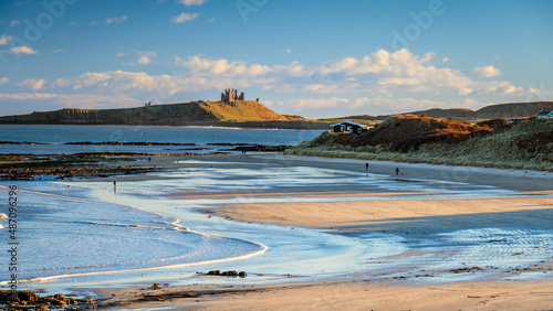 Low Newton Beach and Dunstanburgh Castle, part of the coastal section on the Northumberland 250, a scenic road trip though Northumberland with many places of interest along the route photo