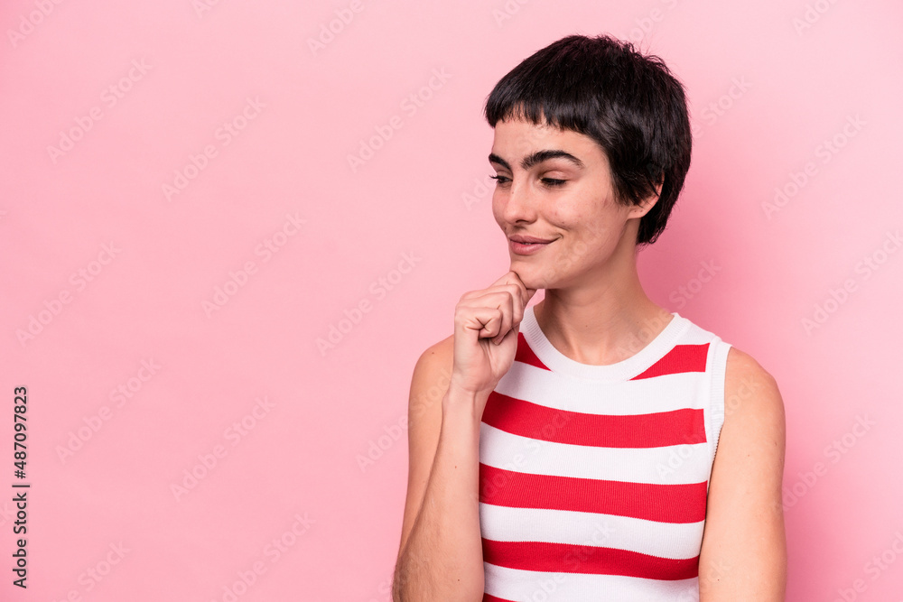 Young caucasian woman isolated on pink background looking sideways with doubtful and skeptical expression. Young caucasian woman isolated on pink background looking sideways with doubtful and skeptical expression.
