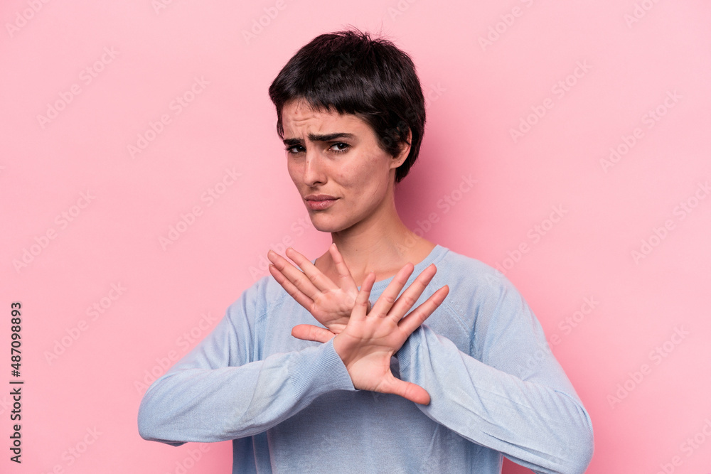 Young caucasian woman isolated on pink background doing a denial gesture Young caucasian woman isolated on pink background doing a denial gesture