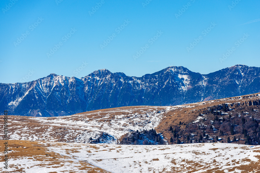 Mountain range of Monte Baldo (Baldo Mount) in winter view from Lessinia Plateau Regional Natural Park. Bosco Chiesanuova municipality, Verona Province, Veneto and Trentino-Alto Adige, Italy, Europe.