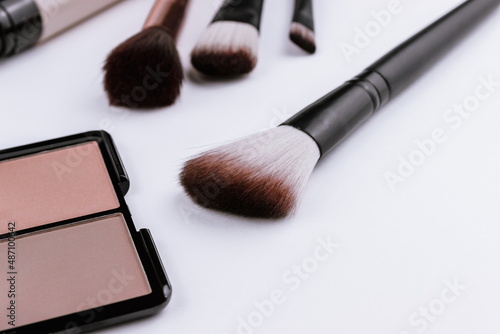 Minimal style,face blush and makeup brushes on white background