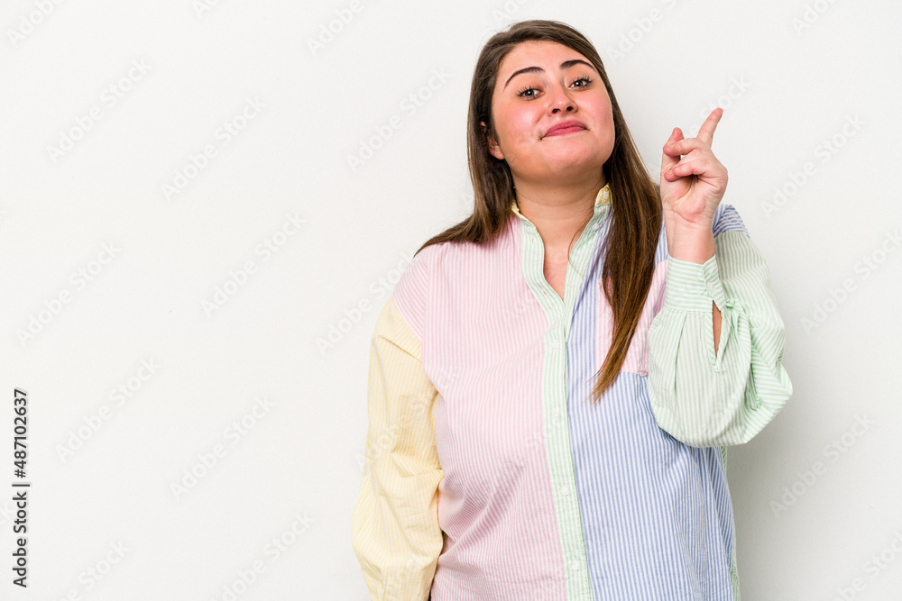 Young caucasian overweight woman isolated on white background showing number one with finger. Young caucasian overweight woman isolated on white background showing number one with finger.