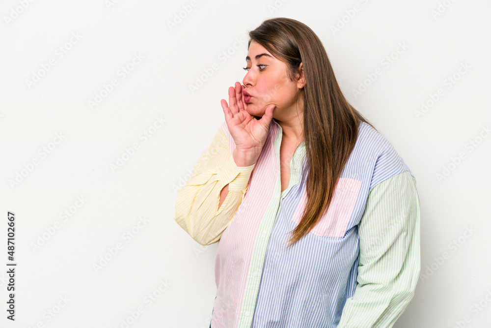 Young caucasian overweight woman isolated on white background is saying a secret hot braking news and looking aside Young caucasian overweight woman isolated on white background is saying a secret hot braking news and looking aside