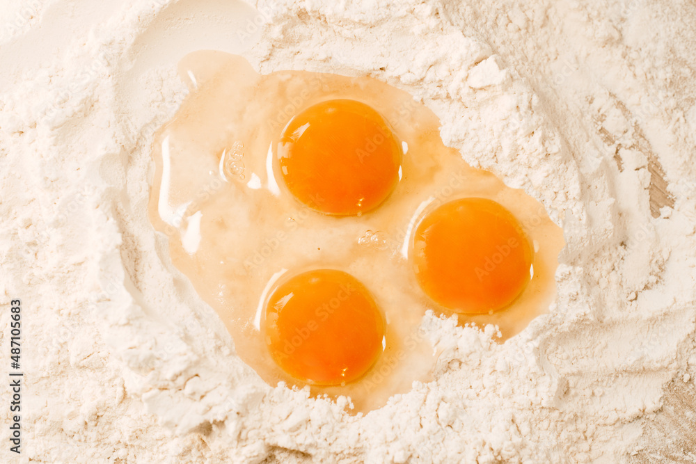 Cooking homemade dough, flour and eggs on the table. Cooking at home, recipes, diet. Pie or cake dough, sweet Cooking homemade dough, flour and eggs on the table. Cooking at home, recipes, diet. Pie or cake dough, sweet