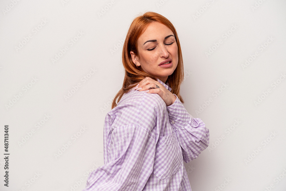 Young caucasian woman isolated on white background having a shoulder pain. Young caucasian woman isolated on white background having a shoulder pain.