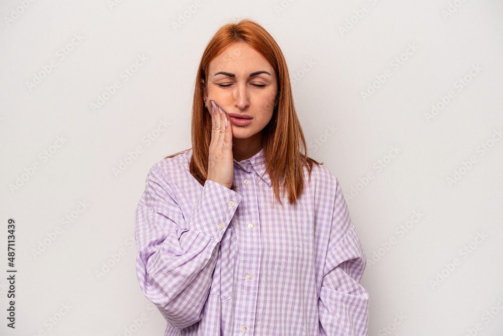 Fototapeta premium Young caucasian woman isolated on white background having a strong teeth pain, molar ache.