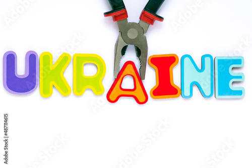 Obraz na płótnie Ukraine text made of toy letters falling apart - a concept of Russia attack on Ukraine and World War 3 thread in Europe. w salonie