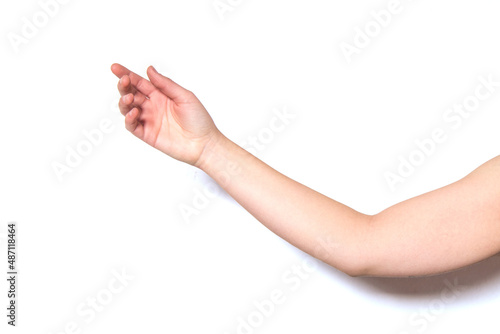 Un brazo de una mujer con la palma de la mano abierta sobre fondo blanco. photo