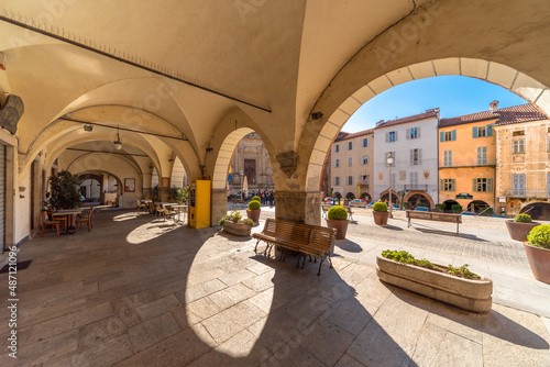 Mondovì, Cuneo, Piedmont, Italy - October 23, 2021: Mondovì Piazza, the arcades of Piazza Maggiore in the center of the old town with its historic buildings