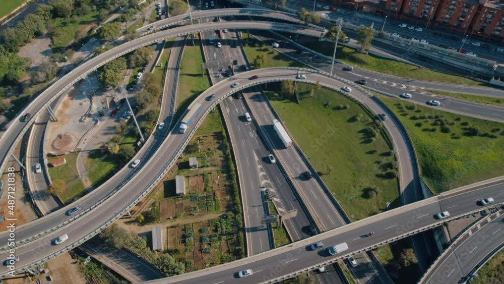 Aerial view of vehicles driving on a traffic junction in the city Aerial view of vehicles driving on a traffic junction in the city
