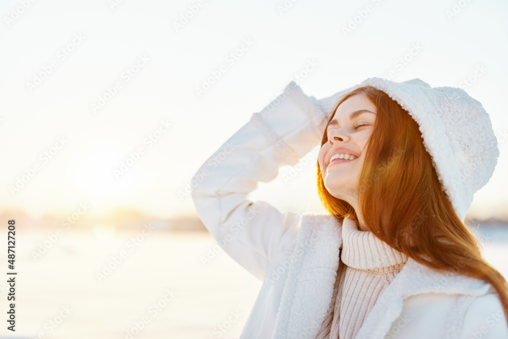 woman red hair snow field winter clothes Sunny winter day Fresh air