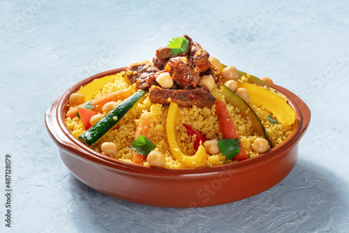 Quadro su tela Meat and vegetable couscous in a bowl, typical food from Morocco, a traditional