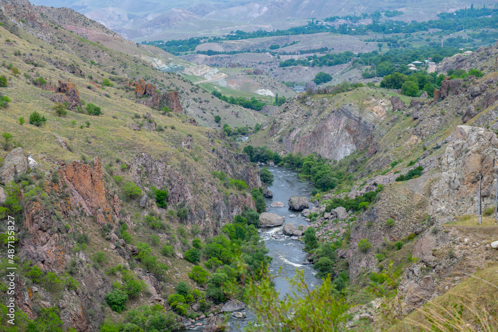 beautiful river runs between the rocky mountains