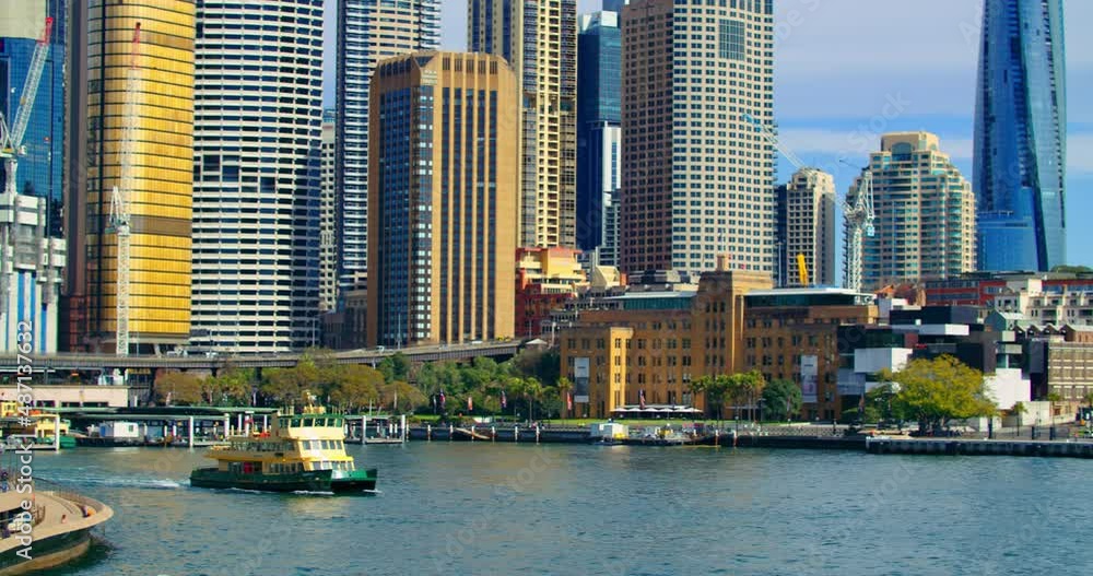 Ferry Boat Cruising In The Sydney Harbour With Crown Sydney Skyscraper In Barangaroo, NSW, Australia. - panning Ferry Boat Cruising In The Sydney Harbour With Crown Sydney Skyscraper In Barangaroo, NSW, Australia. - panning