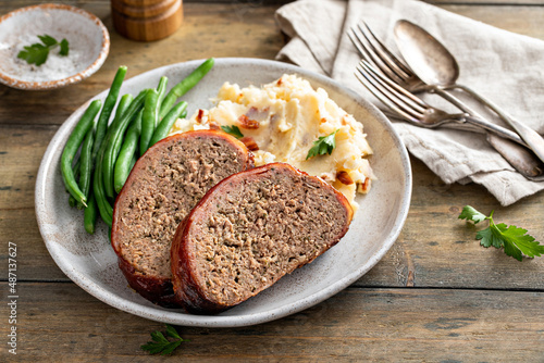 Meatloaf with mashed potatoes and green beans photo