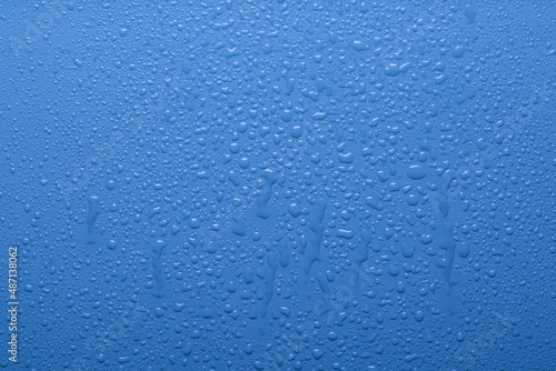 Water drops on blue color surface