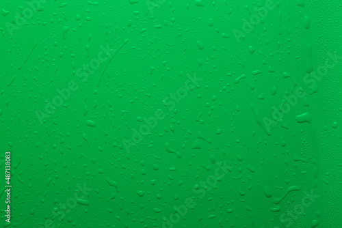 Water drops on green color surface