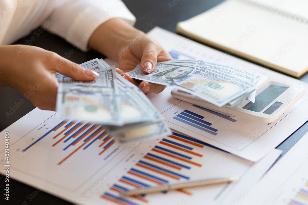 Hand holding banknotes counting money. Hand holding banknotes counting money.