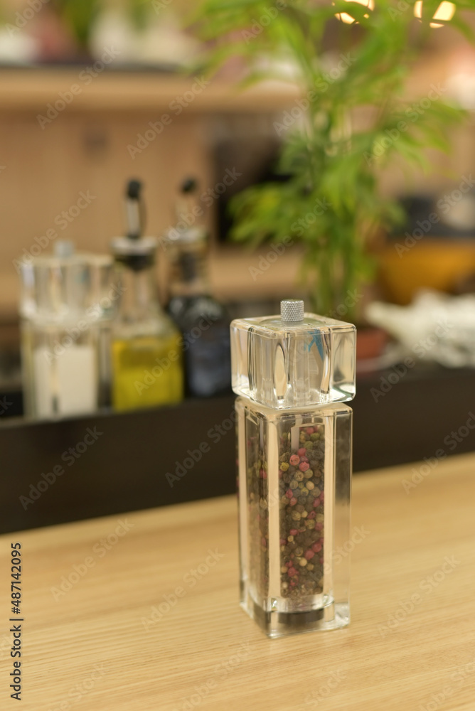 Spices in glass containers. A set of spices in a restaurant Spices in glass containers. A set of spices in a restaurant