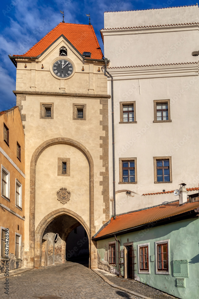 Old town view of narrow aisle with city gate in Jindrichuv Hradec, a town in the Czech Republic in the region South Bohemia. The old town view.