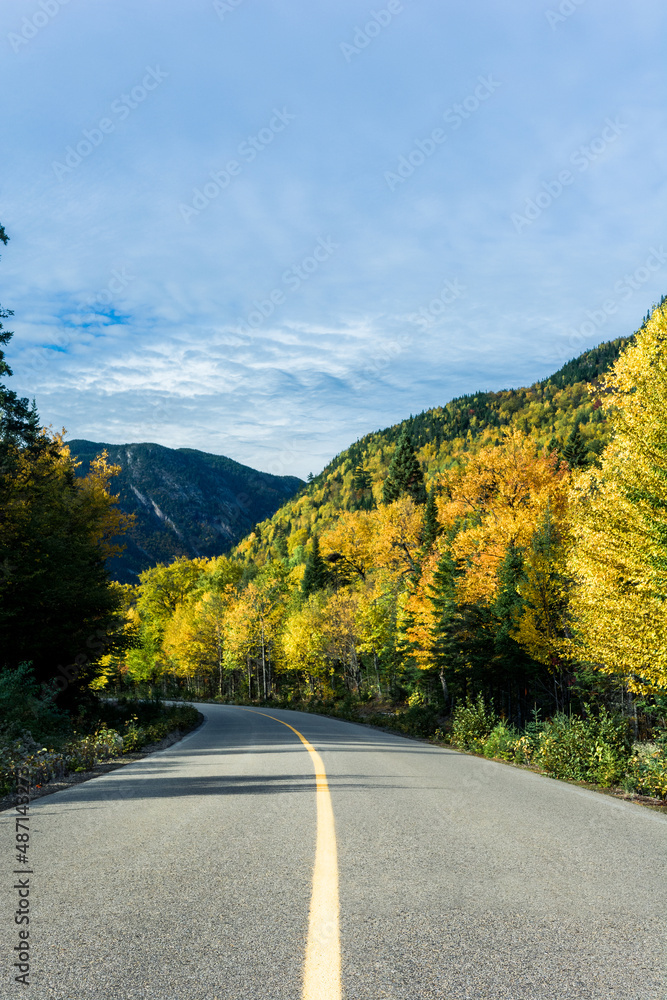 Mountain winding road. Road bend. Picturesque autumn scenery with forest hill
