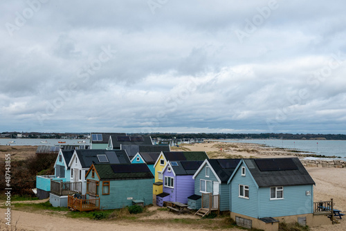 beach huts on Mudeford Spit England on a winter day © Penny
