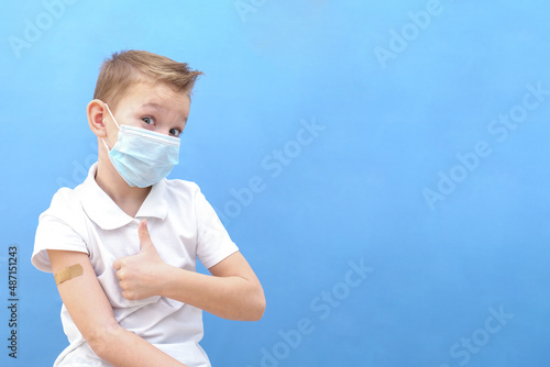 a child in a protective mask was given a vaccine against the disease, coronavirus or covid-19.