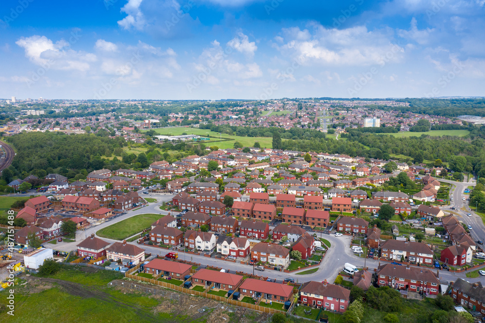 Aerial Photo of a the village of Halton Moor and Osmondthorpe in Leeds West Yorkshire in the UK on a bright sunny summers day showing the large council house housing estate in the summer.
