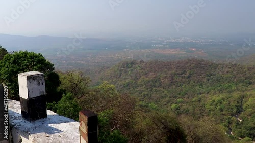 roadside view of mountain covered with forests at morning photo