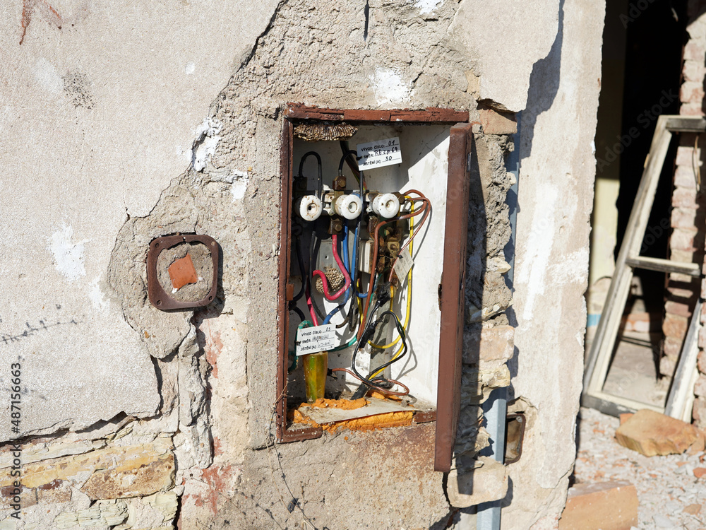Abandoned and dismantled building. Close-up view of an open cabinet with electricity. Abandoned and dismantled building. Close-up view of an open cabinet with electricity.