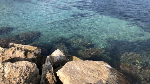 Coastline with big stones and clear sea water