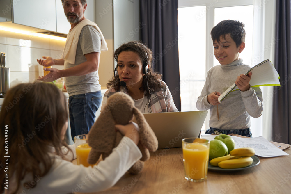 Attentive mother looking at her kid with plush rabbit Attentive mother looking at her kid with plush rabbit