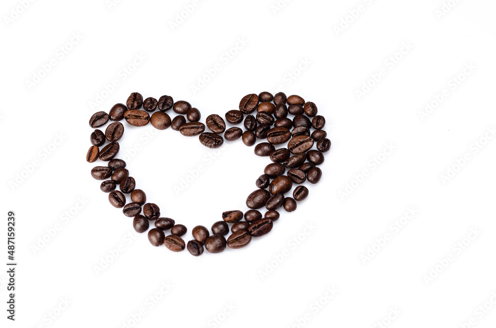 Heart background with roasted coffee beans on a white background Heart background with roasted coffee beans on a white background