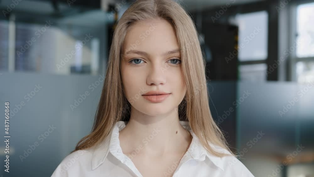 Female portrait closeup confident serious pretty attractive young caucasian woman blonde student professional manager office worker businesswoman model posing looks at camera career successful concept Female portrait closeup confident serious pretty attractive young caucasian woman blonde student professional manager office worker businesswoman model posing looks at camera career successful concept