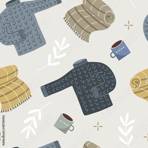 Hand drawn vector seamless pattern with cozy sweaters, warm blankets and mugs