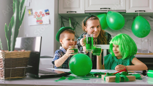 Family mom and kids celebrate St. Patrick's Day.