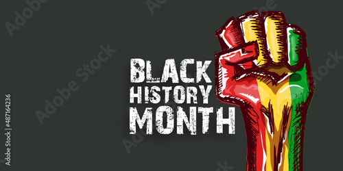 Black history month horizontal banner with protest raised fist colored in African flag isolated on grey background. Black history month horizontal poster, flyer with black mans fist
